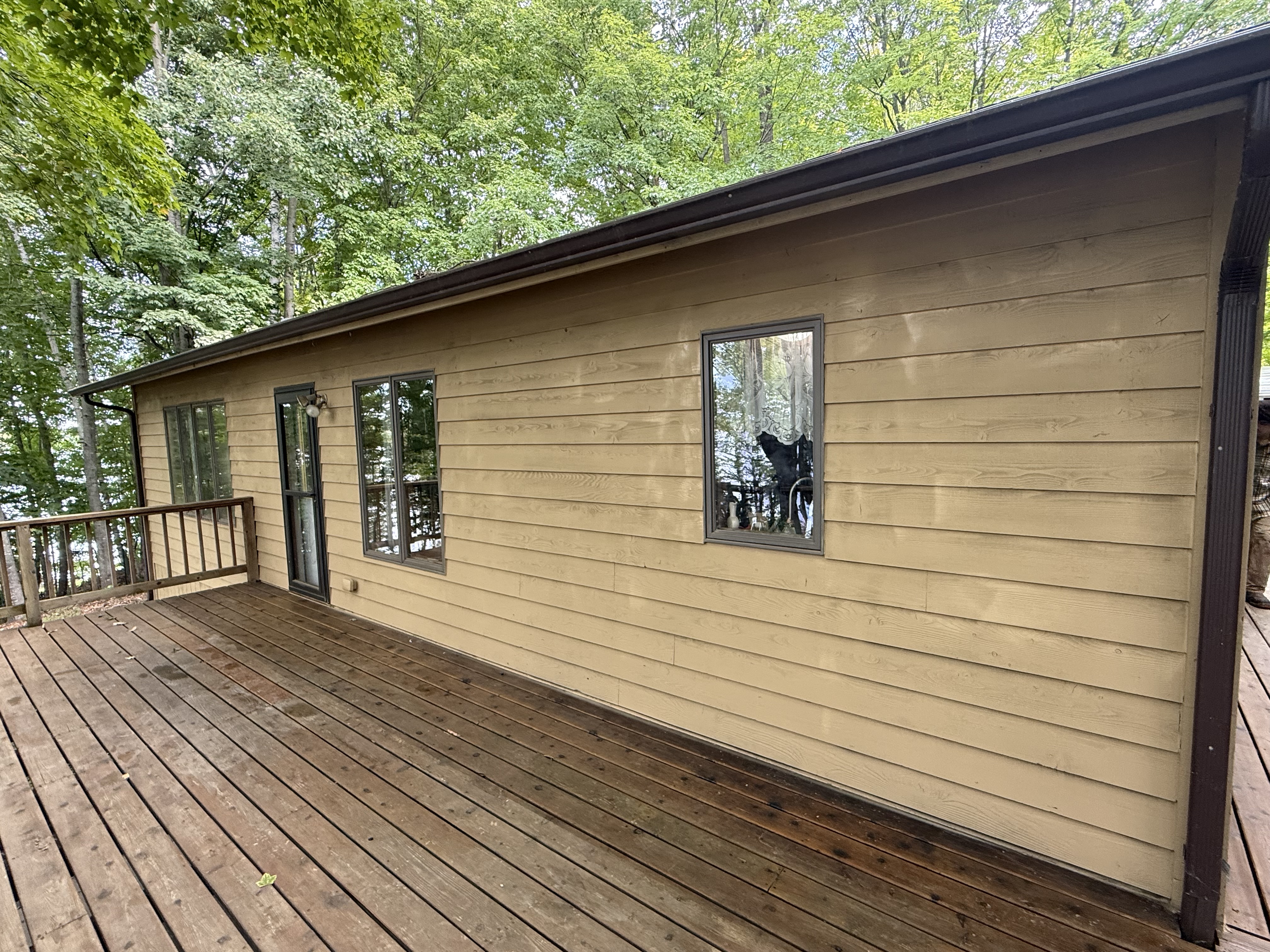 Refinished lakeside deck and renewed wood-look siding